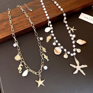Elegant marine-themed pearl and gold chain necklaces with starfish and shell charms.
