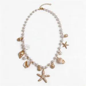 Elegant pearl necklace with starfish and sea shell charms for beach vacation style.