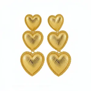 Elegant gold-plated tiered heart drop earrings with textured finish and beaded edges for women.