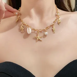 Detailed view of a gold nautical charm necklace with starfish and pearls.