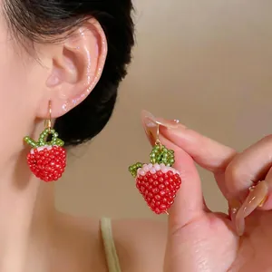 Handmade red beaded strawberry drop earrings with gold-toned hooks