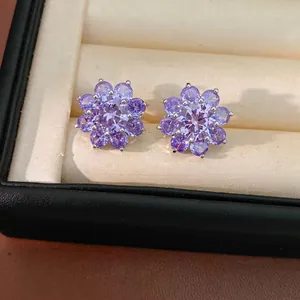 Elegant purple zircon flower stud ear clips for women presented in a black jewelry box