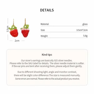 Detailed view of handmade strawberry glass bead earrings with dimensions and material specs