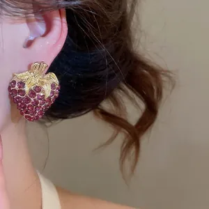 Vintage gold-plated strawberry stud earrings with purple rhinestones for elegant women