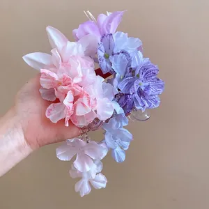 Elegante stoffen bloem haarclips met lange kwastjes voor strandvakantie