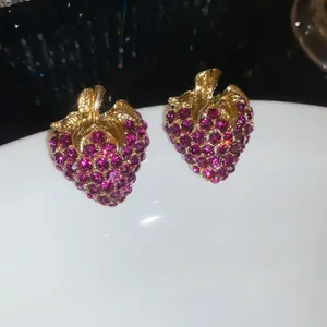 Exquisite vintage style strawberry stud earrings featuring purple rhinestones and gold plating