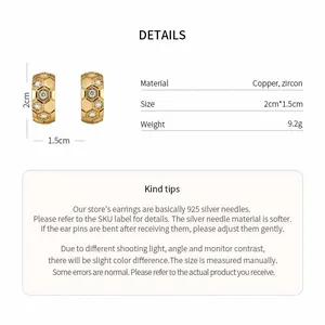 Detailed view of C-shaped earrings featuring honeycomb zircon design and 18k gold plating