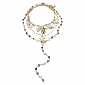Gold multi-layered necklace with starfish, pearls, and colorful stones for beach resort