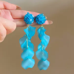 Detailed close-up view of blue crystal beaded earrings with cascading flower petals