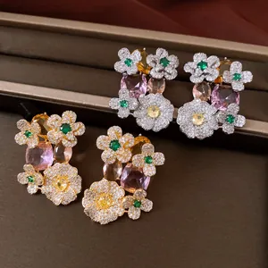 Detailed view of luxury vintage floral stud earrings with colorful zircons and stones