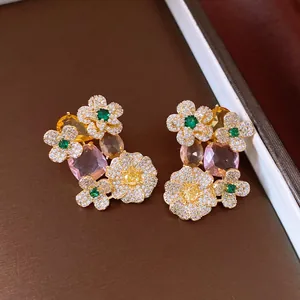 Detailed close-up of vintage floral earrings featuring vibrant multi-color zircon stones
