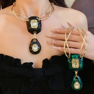 Luxurious vintage crystal pendant necklace with distorted fold design in black and green colors