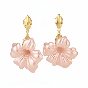 Elegant vintage resin flower drop earrings with gold shell studs on white background