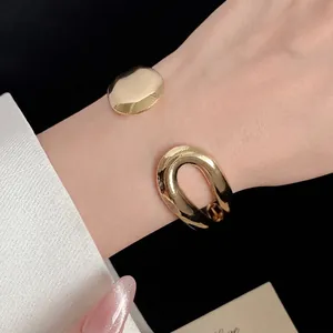 Elegant gold water drop open cuff bracelet with minimalist retro design for women