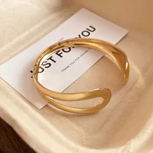 Elegant gold-tone water drop open bangle bracelet with minimalist vintage design