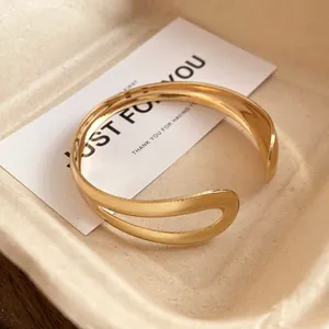 Detailed view of a vintage-style gold water-drop open cuff bracelet for women's fashion