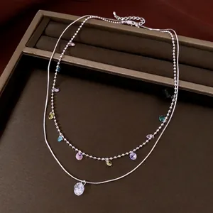 Elegant double-layered silver necklace with colorful teardrop zircons and clear pendant