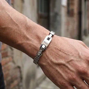 Detailed view of mens stainless steel mesh chain bracelet with polished rectangular bar