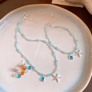 Parure de bijoux en perles bleues avec pendentifs étoile de mer et cristaux carrés