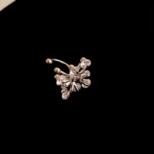 Macro view of a sparkling zircon butterfly ear cuff on a professional black background