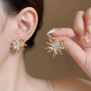 Elegant gold sunflower stud earrings with sparkling crystals, vintage French style design