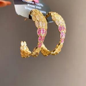 Luxury C-shaped gold plated hoop earrings encrusted with pink and white zircon stones