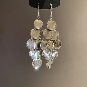 Silver tiered circular disc earrings with bohemian geometric tassel dangle design