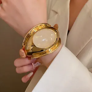 Vintage luxury gold open cuff bracelet with large oval cream stone inlay for women