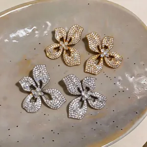 Elegant 3D flower stud earrings with sparkling crystals in gold and silver tones
