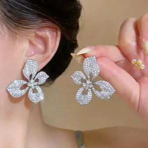 Elegant 3D silver flower stud earrings with sparkling crystals for bridal wedding wear