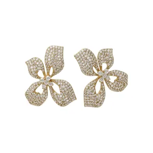 Elegant gold-plated flower stud earrings with shimmering clear crystals for brides.