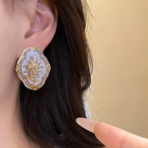 Vintage palace style floral stud earrings with silver needles and rhinestones