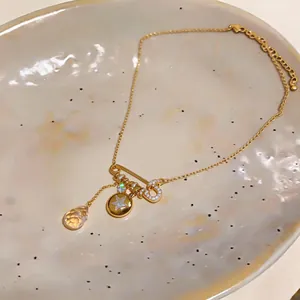 Close-up of luxury 18K gold-plated necklace with delicate star charm and zircons