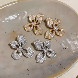 Elegant silver needle flower stud earrings with sparkling crystals for bridal wear