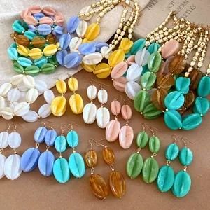 Detailed view of colorful acrylic marbled beaded necklaces and earrings collection