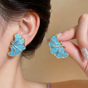 Elegant French style blue enamel flower stud earrings with gold trim floral details