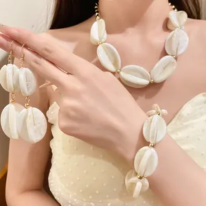 Close-up of elegant white acrylic marbled beaded necklace and jewelry set on model