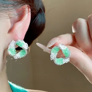 Elegant s925 silver needle vortex stud earrings with green glass and zircon stones