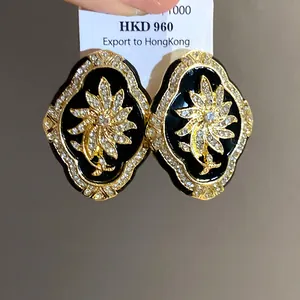 Detailed macro view of vintage court style flower earrings with sparkling rhinestones