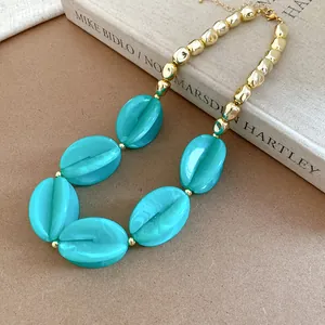 Bohemian chunky teal acrylic marbled bead necklace with irregular polished gold accents