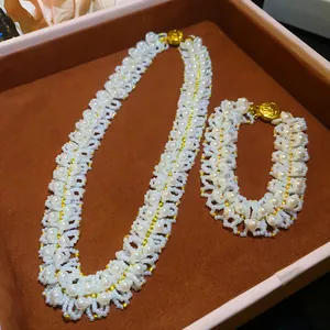 Detailed view of handcrafted woven pearl necklace and bracelet set in jewelry box