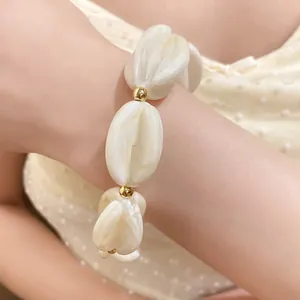 Close-up of elegant marbled acrylic beads on a stylish bracelet with gold metallic accents