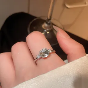 Detailed macro view of a vintage silver ring featuring a sparkling cushion-cut zircon