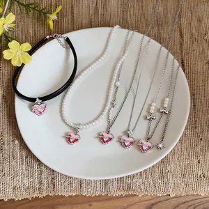 Sweet Korean style zircon enamel heart necklaces collection on white plate display
