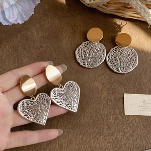 Elegant heart-shaped and round hollow earrings in gold and silver finish