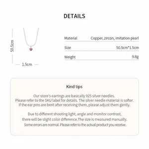 Detail showing material and size specs for the heart pendant necklace.