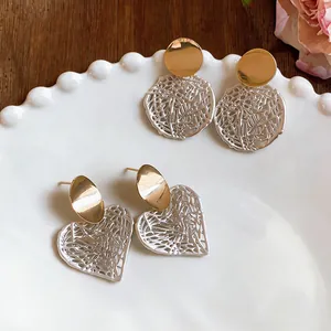 Korean style hollow silver heart and round stud earrings with gold finish detail