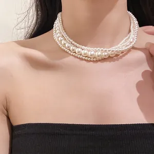 Elegant French style multi-strand white pearl choker necklace shown on a female model
