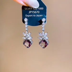 Sparkling zircon geometric lozenge drop earrings for women with purple crystal accents