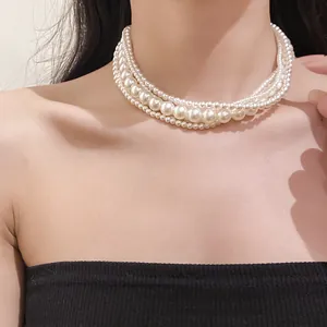 Close-up detail of an elegant multi-layer white pearl choker necklace in French style